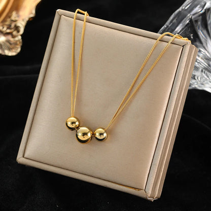 Colar Feminino em Aço Inoxidável 316L Dourado com Pingente de Esferas Vazadas